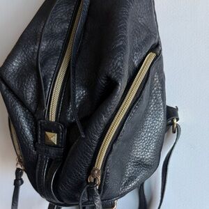 Black Small Sling Backpack with Gold Accents